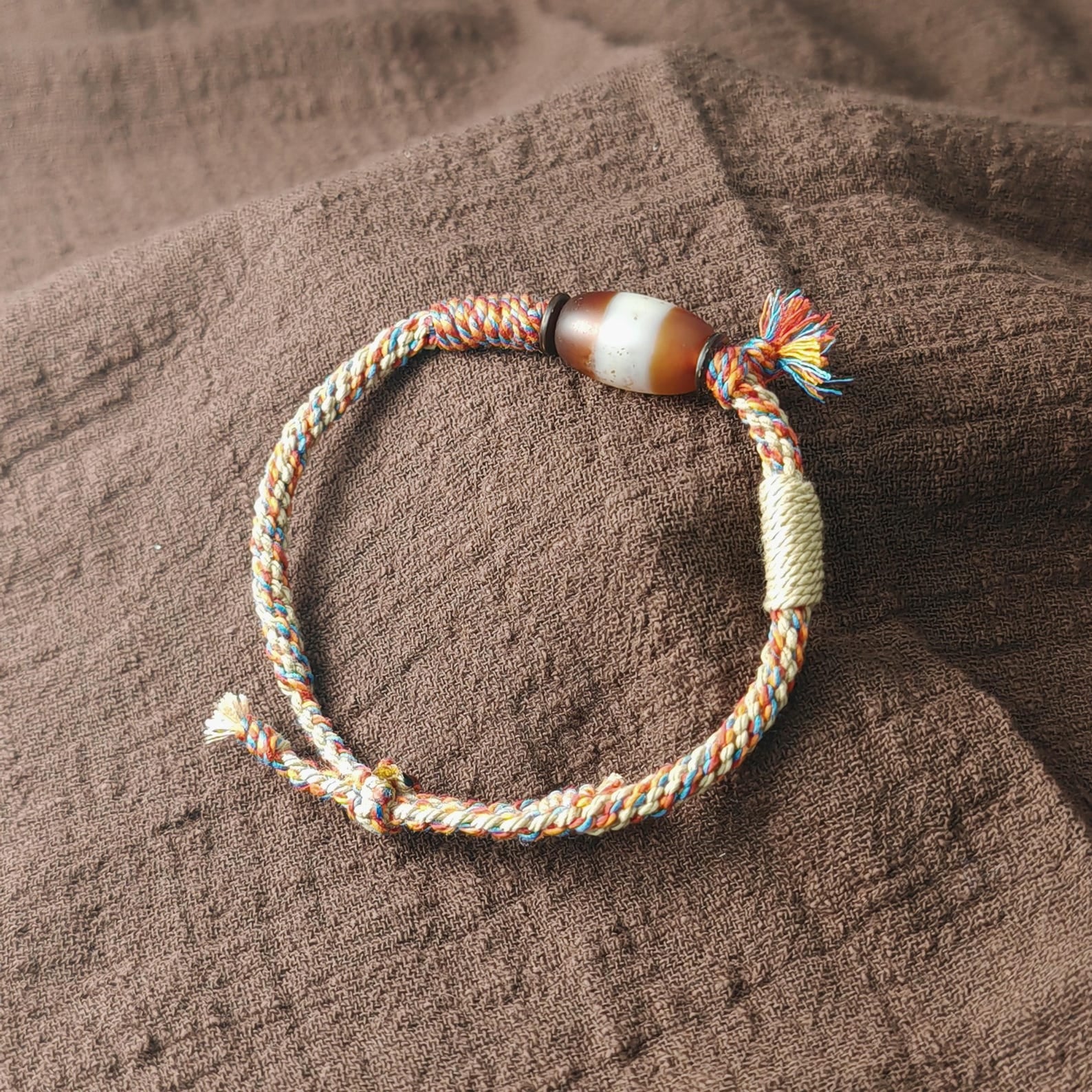 Jumlum Hand Woven Bracelet with Fire Agate Tibetan Stripe Dzi Beads