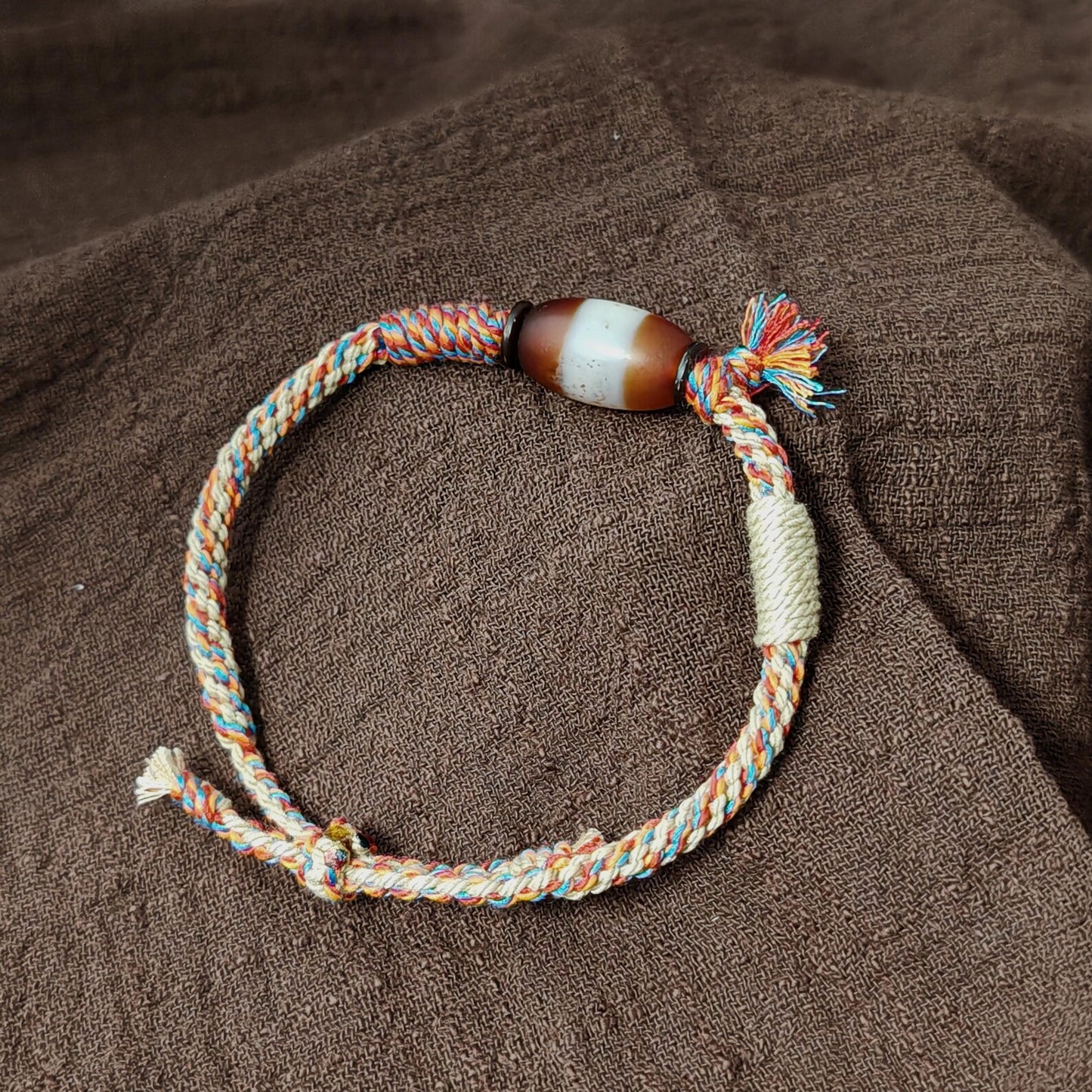 Jumlum Hand Woven Bracelet with Fire Agate Tibetan Stripe Dzi Beads