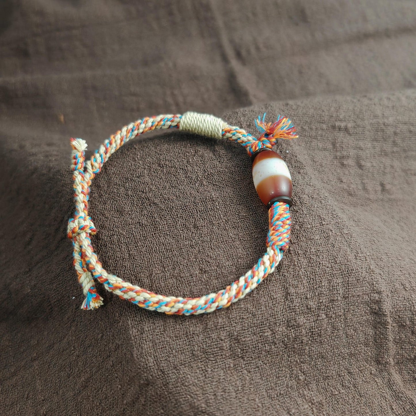 Jumlum Hand Woven Bracelet with Fire Agate Tibetan Stripe Dzi Beads