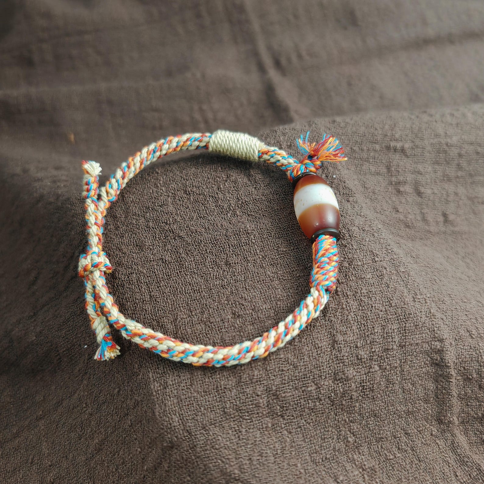 Jumlum Hand Woven Bracelet with Fire Agate Tibetan Stripe Dzi Beads