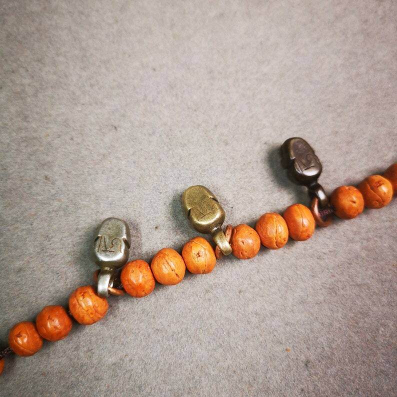 Mala Pendant,Skull Citipati Amulet for Prayer Beads - Tibetan Buddhist mala beads, close-up detail