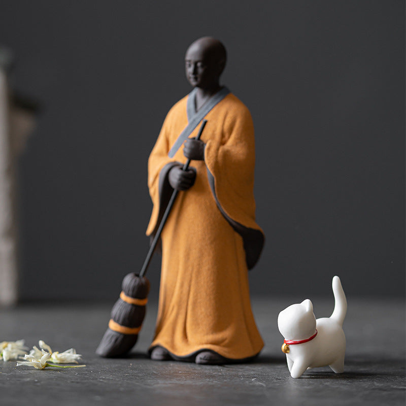 Sweeping Monk Buddha Statue