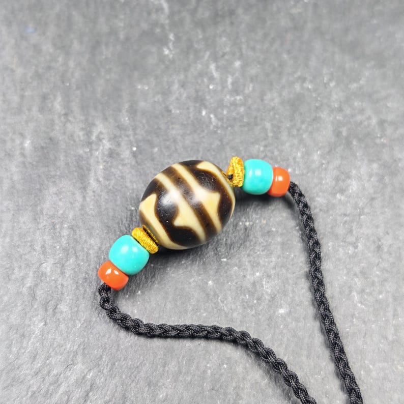Tiger Tooth Dzi Bead Necklace - Tibetan Buddhist bead necklace, close-up detail