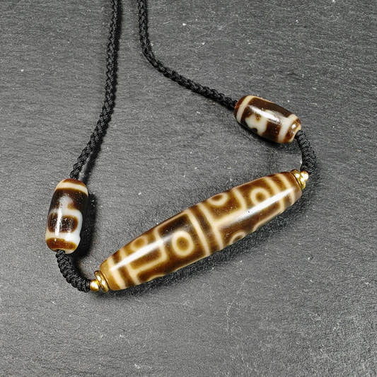12 Eyes Dzi Bead Necklace Tibetan Protection Charm for Courage and Fame - Tibetan Buddhist bead necklace, front view