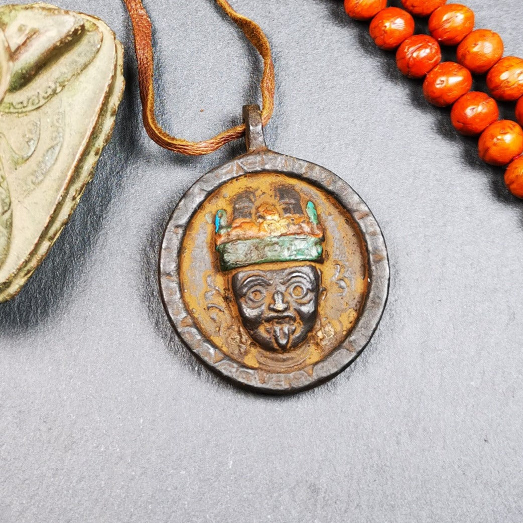 This unique Drashi Lhamo amulet pendant was collected from Rejia County. It is made of copper,painted color,size is about 1.9 × 1.5 inches, the front is Drashi Lhamo and the back is tibetan letter,means :mind,body,speach. Drashi Lhamo is auspicious god of wealth incarnated in the world,you can make it a pendant,or just put into your shrine.