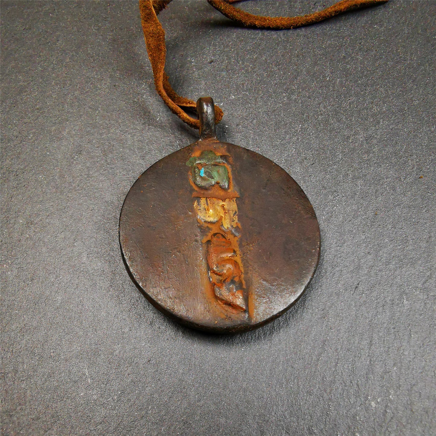 This unique Drashi Lhamo amulet pendant was collected from Rejia County. It is made of copper,painted color,size is about 1.9 × 1.5 inches, the front is Drashi Lhamo and the back is tibetan letter,means :mind,body,speach. Drashi Lhamo is auspicious god of wealth incarnated in the world,you can make it a pendant,or just put into your shrine.