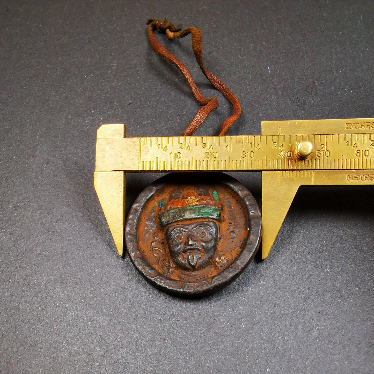 This unique Drashi Lhamo amulet pendant was collected from Rejia County. It is made of copper,painted color,size is about 1.9 × 1.5 inches, the front is Drashi Lhamo and the back is tibetan letter,means :mind,body,speach. Drashi Lhamo is auspicious god of wealth incarnated in the world,you can make it a pendant,or just put into your shrine.