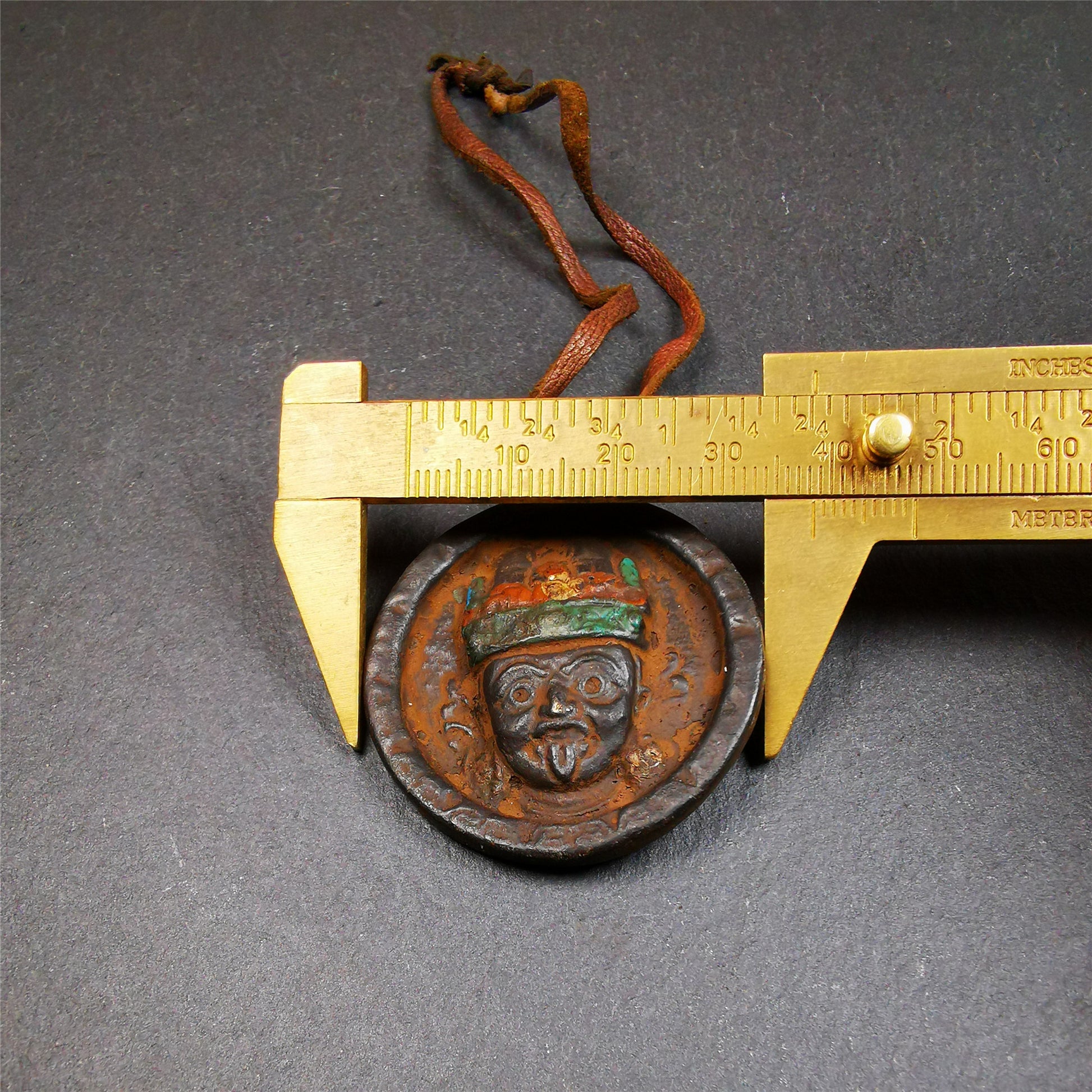This unique Drashi Lhamo amulet pendant was collected from Rejia County. It is made of copper,painted color,size is about 1.9 × 1.5 inches, the front is Drashi Lhamo and the back is tibetan letter,means :mind,body,speach. Drashi Lhamo is auspicious god of wealth incarnated in the world,you can make it a pendant,or just put into your shrine.