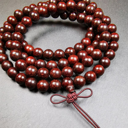 This mala was made by Tibetan craftsmen from Hepo Town, Baiyu County, the birthplace of the famous Tibetan handicrafts.  It is made of Dalbergia Wood(Huanghuali), brown color,108 round cut beads diameter of 9mm / 0.35",circumference is 92cm / 36".