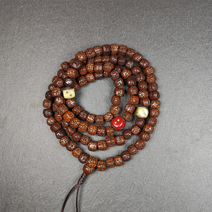 This old mala was handmade from tibetan crafts man in Baiyu County,blessed in Baiyu monastery. It's composed of 108 pcs 9mm rudraksha beads,with 3 carved dice beads,bead diameter is 0.35 inch and circumference is 35 inches.