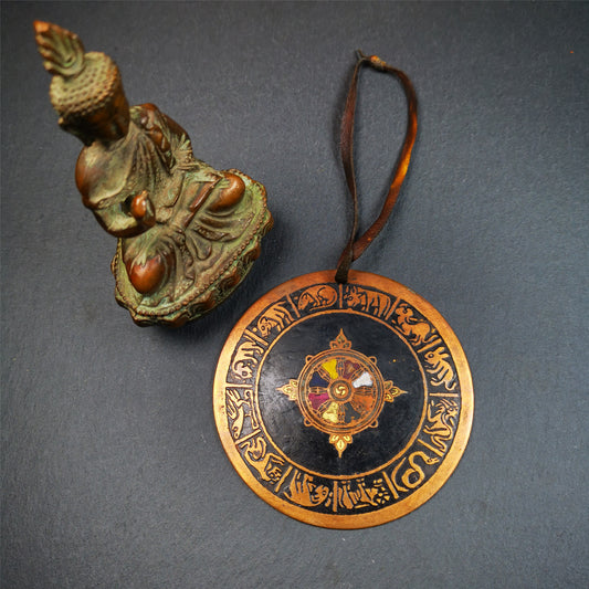 This beautiful prayer wheel badge was collected in Derge, Tibetan. It is made of brass, carved paryer wheel in the middle and Tibetan zodiac signs around it,then painted with color,size is 2.95". You can hang it at the door or in your shrine.