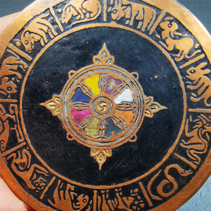 This beautiful prayer wheel badge was collected in Derge, Tibetan. It is made of brass, carved paryer wheel in the middle and Tibetan zodiac signs around it,then painted with color,size is 2.95". You can hang it at the door or in your shrine.