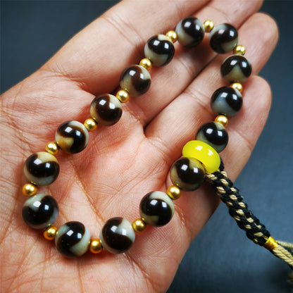 This tiger tooth dzi bracelet was hand-woven by Tibetans from Baiyu County,Tibet. It consists of 15 tiger tooth dzi beads and 15 spacer beads,tie with elastic cord to fit your wrist.  Dzi beads are precious jewelry from Tibetan culture which are believed to possess the power of bringing good fortune to the owners.  You'll get 1 dzi bracelet as pictures shown.