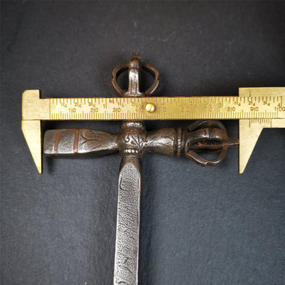 This vajra hammer was handmade by Tibetan craftsmen from Tibet in 1990's,from Hepo Town, Baiyu County, the birthplace of the famous Tibetan handicrafts. It is one ritual of dharma ritual implements,made of cold iron inlaid copper wire,size is 11.8 inches length.