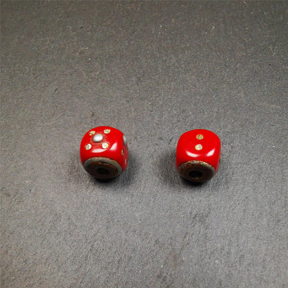 These marker beads were handmade by Tibetan craftsmen and come from Hepo Town, Baiyu County, the birthplace of the famous Tibetan handicrafts. It is made of plastic,inlaid cold iron,red color,size is 0.47" × 0.47". Fit for 8-12mm mala (The reference in the photo is 8mm mala)