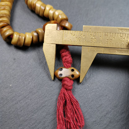 This unique wave shape mala was made by Tibetan craftsmen and come from Hepo Town, Baiyu County, the birthplace of the famous Tibetan handicrafts,about 30 years old. It is made of yak bone, yellow color,108 wave shape beads diameter of 10mm / 0.4",circumference is 48cm / 18.9", end of bone guru bead and vajra pendant. It reflects the original ascetic state of the original ecology, very simple and full of sense of time