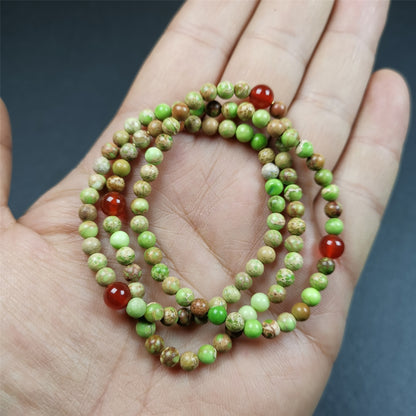 This small size turquoise mala was handmade from tibetan crafts man in Baiyu County. It's composed of 108 pcs 4mm turquoise beads, add 4 agate beads,string then with elastic cord and fit snugly around your wrist.