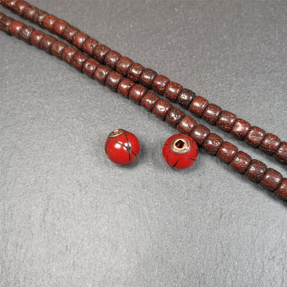 These marker beads were handmade by Tibetan craftsmen. It is made of plastic,inlaid copper and cold iron,red color,size is 0.6" × 0.6". Fit for 8-15mm mala (The reference in the photo is 8mm mala)