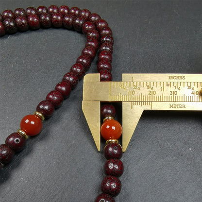 This mala is made by Tibetan craftsmen and come from Hepo Town, Baiyu County,Tibet, the birthplace of the famous Tibetan handicrafts. It's composed of 108 pcs 9mm lotus seed beads,with agate spacer beads,and agate bead counters,diameter 0.35 inch,circumference 35 inches.