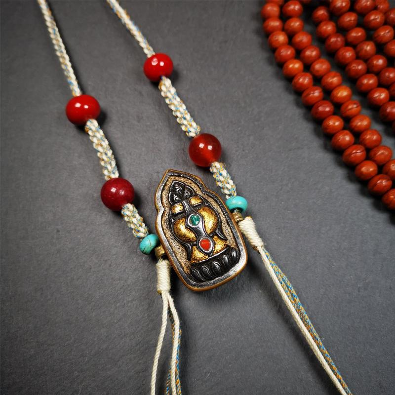 This portable Gau shrine was handcrafted by Tibetan artisans.  Its theme is mani jewel, a treasure vase on a lotus base, inside the vase are mani jewels and other jewels. Each exquisite pattern on it is meticulously hand-carved,and it is embellished with the technique of gold inlay, with cold iron and pure silver inlaid on the red copper material and gold-plated on the pure silver material,inlaid with turquoise and agate bead. 