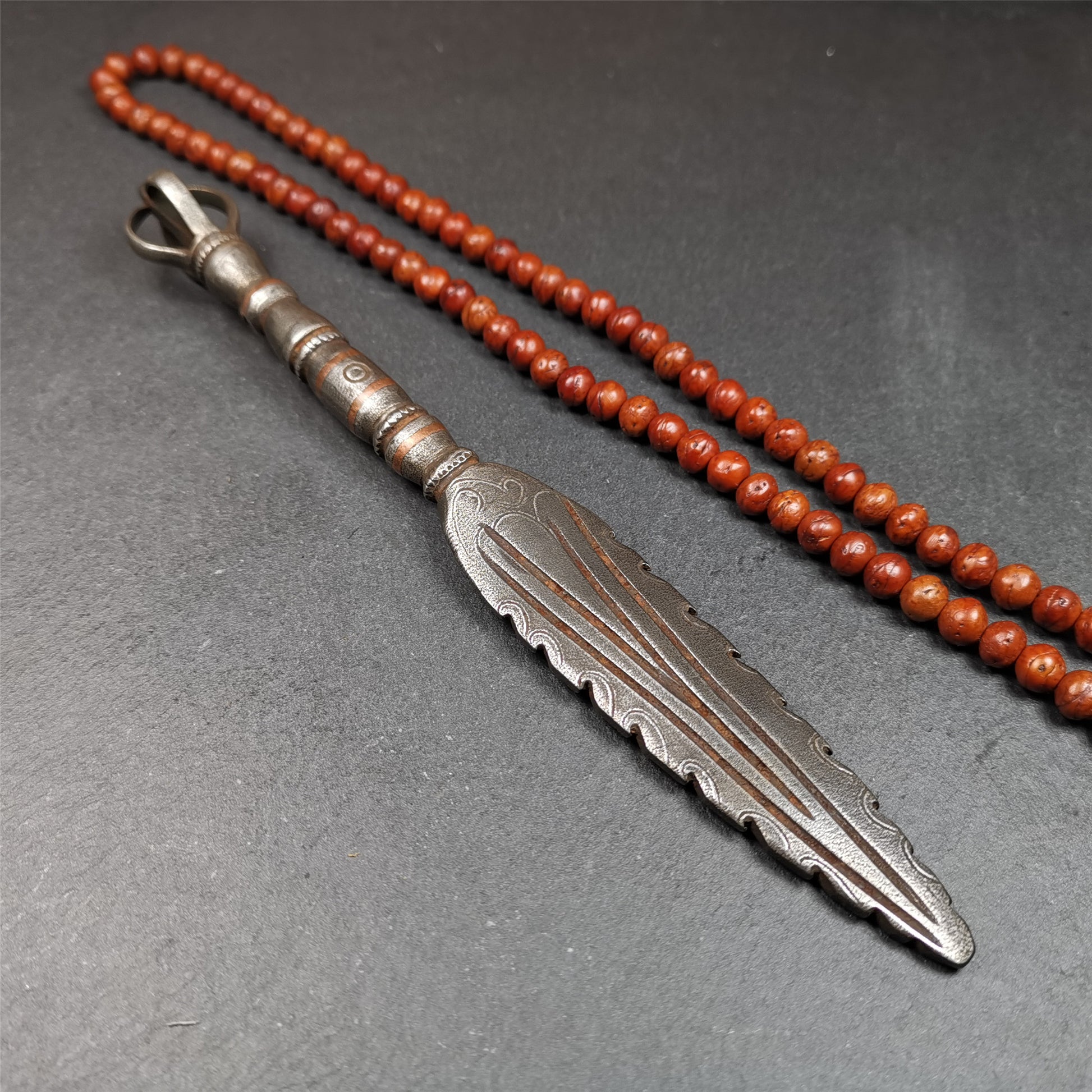 This vajra sword was handmade by Tibetan craftsmen from Tibet in 1990s. It's Fire Vajra Sword of Wisdom Buddha Manjushri,made of cold iron,inlaid red copper stripe,carved with flame pattern, and the half vajra at the tail,8.3 inches length.