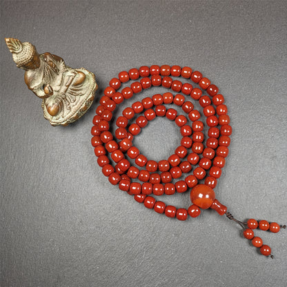 This mala was made by Tibetan craftsmen and come from Hepo Town, Baiyu County, the birthplace of the famous Tibetan handicrafts.  It is made of Agate,barrel shape, diameter of 10mm / 0.4",circumference is 98cm / 39".end of agate disciple be