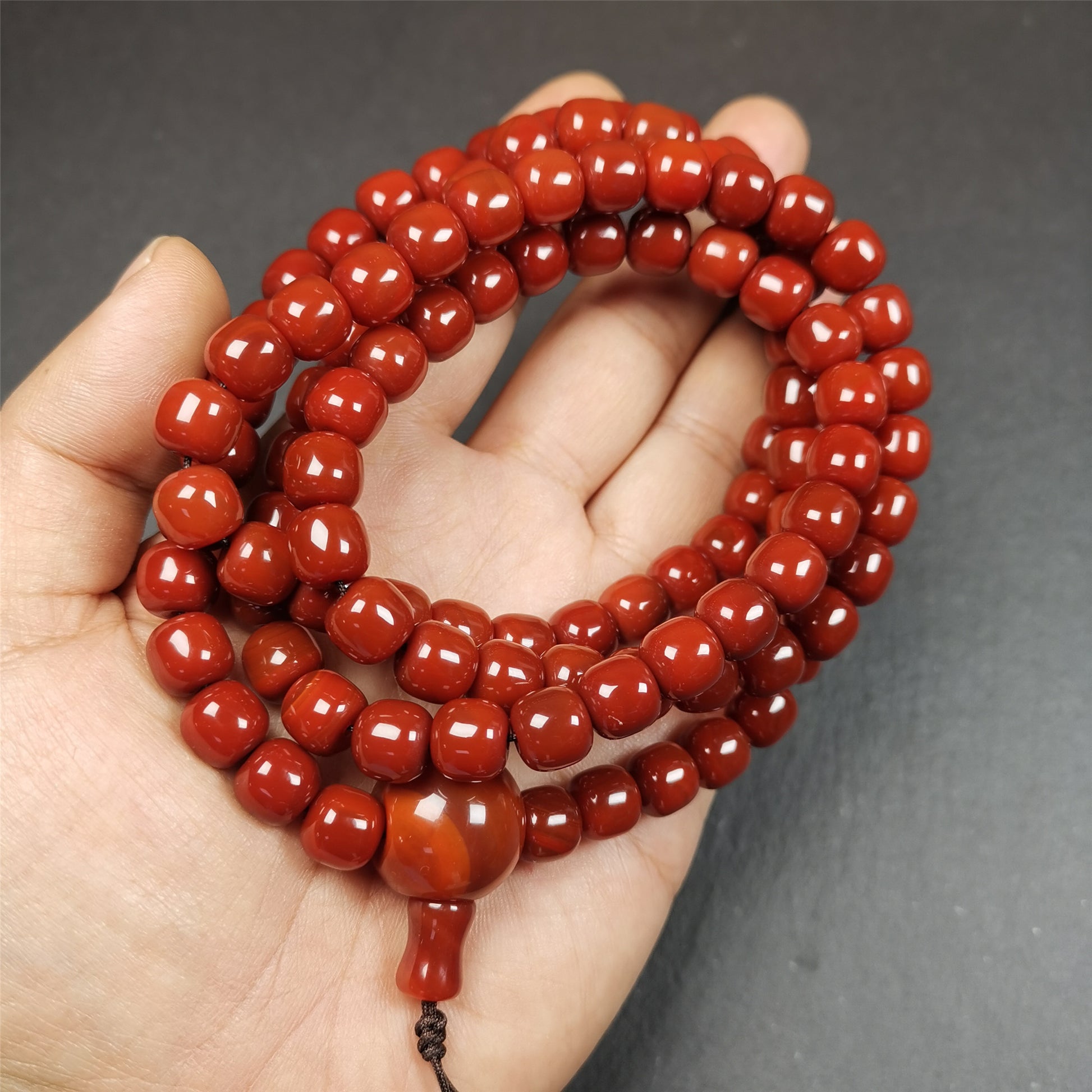 This mala was made by Tibetan craftsmen and come from Hepo Town, Baiyu County, the birthplace of the famous Tibetan handicrafts.  It is made of Agate,barrel shape, diameter of 10mm / 0.4",circumference is 98cm / 39".end of agate disciple be