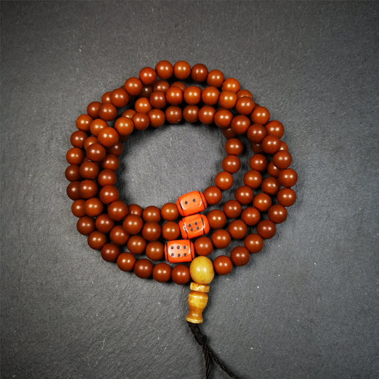 This mala was made by Tibetan craftsmen and come from Hepo Town, Baiyu County, the birthplace of the famous Tibetan handicrafts.  It is made of Corypha Linn Seeds, diameter of 8mm / 0.32",circumference is 90cm / 35" ,with 3 dice bead, end of a yak bone guru bead.