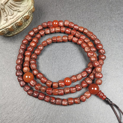 This old Cypress Seed Beads Mala was handmade from tibetan crafts man in Baiyu County,about 30 years old. It is composed of 108 pcs 6.5mm cypress seed beads,then add some old agate beads,end of a agate guru bead.