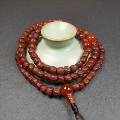 This old Cypress Seed Beads Mala was handmade from tibetan crafts man in Baiyu County,about 30 years old. It is composed of 108 pcs 6.5mm cypress seed beads,then add some old agate beads,end of a agate guru bead.