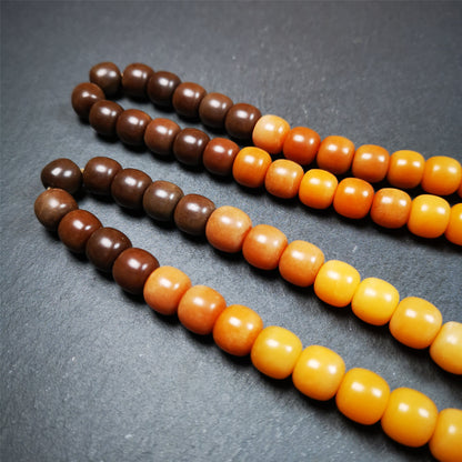 This mala was made by Tibetan craftsmen and come from Hepo Town, Baiyu County, the birthplace of the famous Tibetan handicrafts. It is made of Corypha Linn Seeds, diameter of 10mm / 0.4",gradient color, designed as a couple set,the large size for men, small size for women.