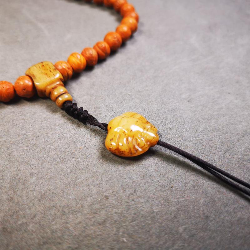 This unique bone carved scorpion pendant is made by Tibetan craftsmen.  You can make it as a mala pendant below the guru bead, or spacer bead on mala. Also can be use as pendant or keychain.