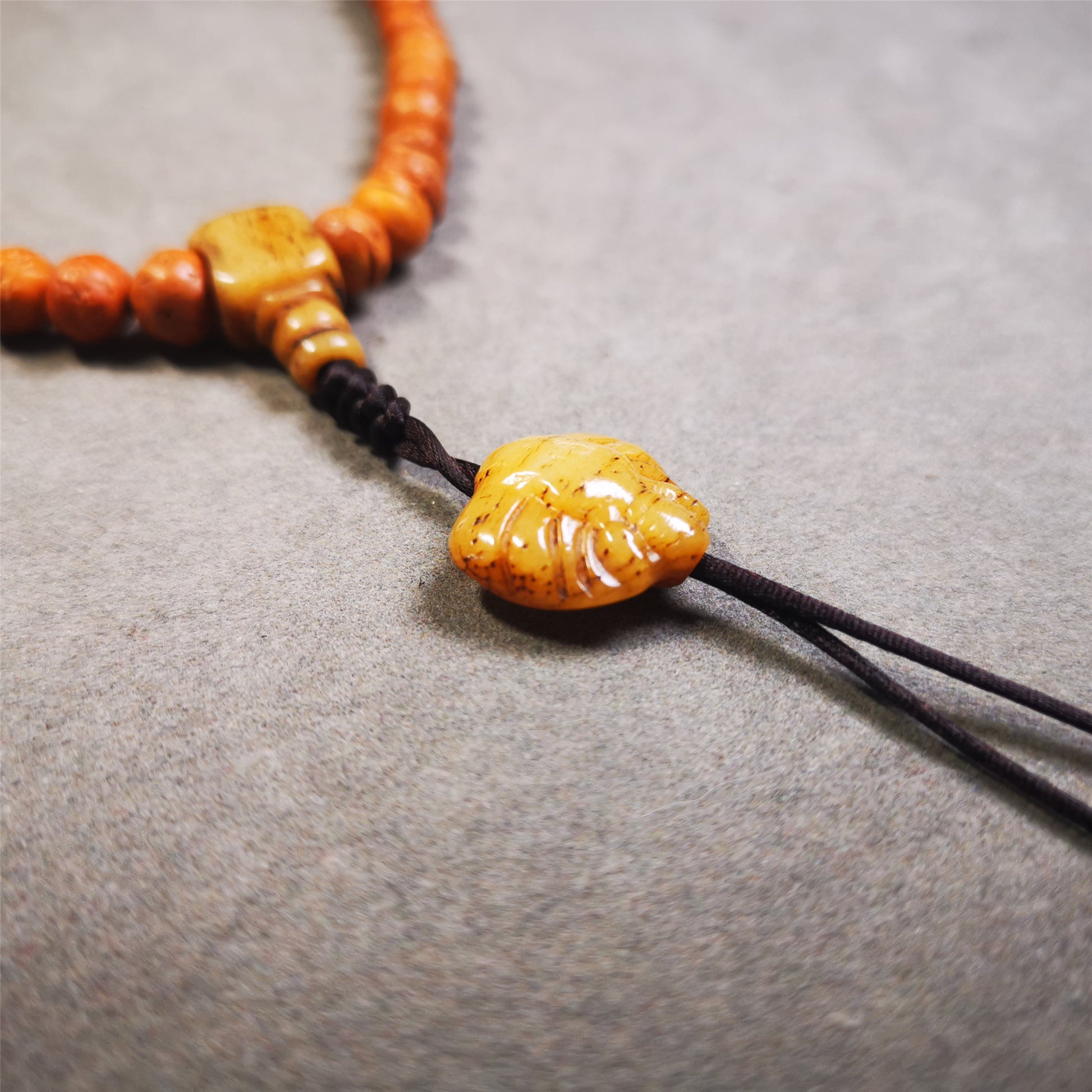 This unique bone carved scorpion pendant is made by Tibetan craftsmen.  You can make it as a mala pendant below the guru bead, or spacer bead on mala. Also can be use as pendant or keychain.