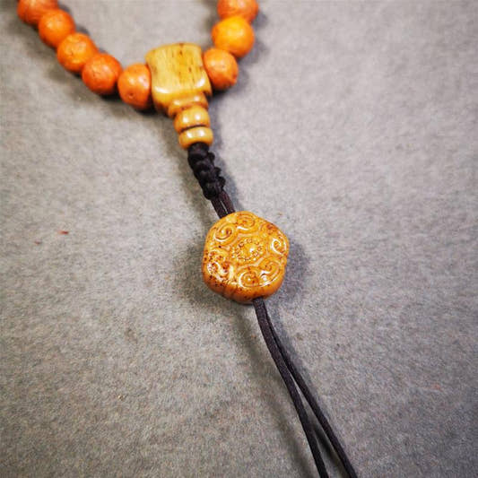 Lucky Knot Bead Amulet 0.63" - Tibetan Buddhist amulet, front view