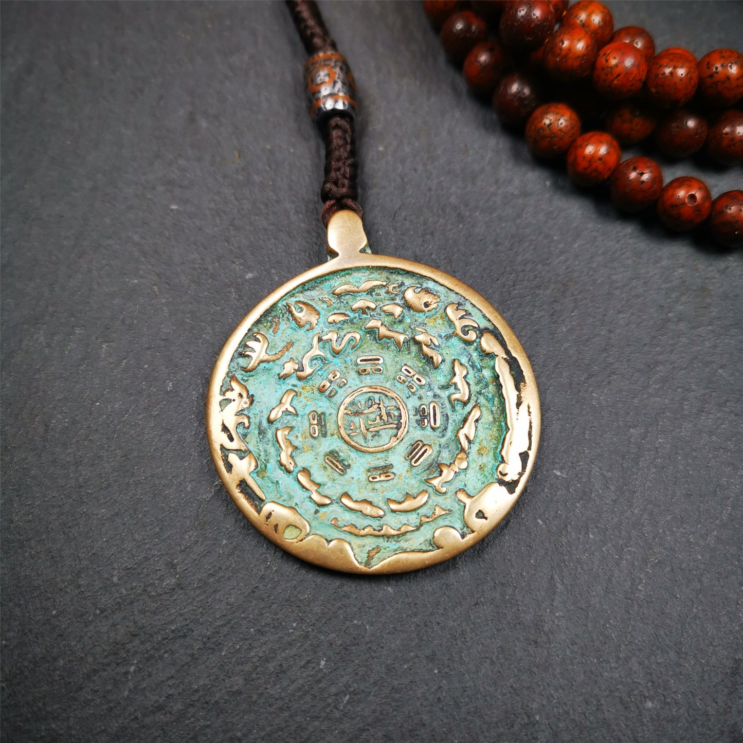 This unique tibetan melong badge was collected from Kathok Monastery,about 50 years old. It's a Astrology Protective Amulet Pendant,made of lima brass. The pattern is Tibetan Budhist Protective Amulet Pendant - SIPAHO(srid pa ho).