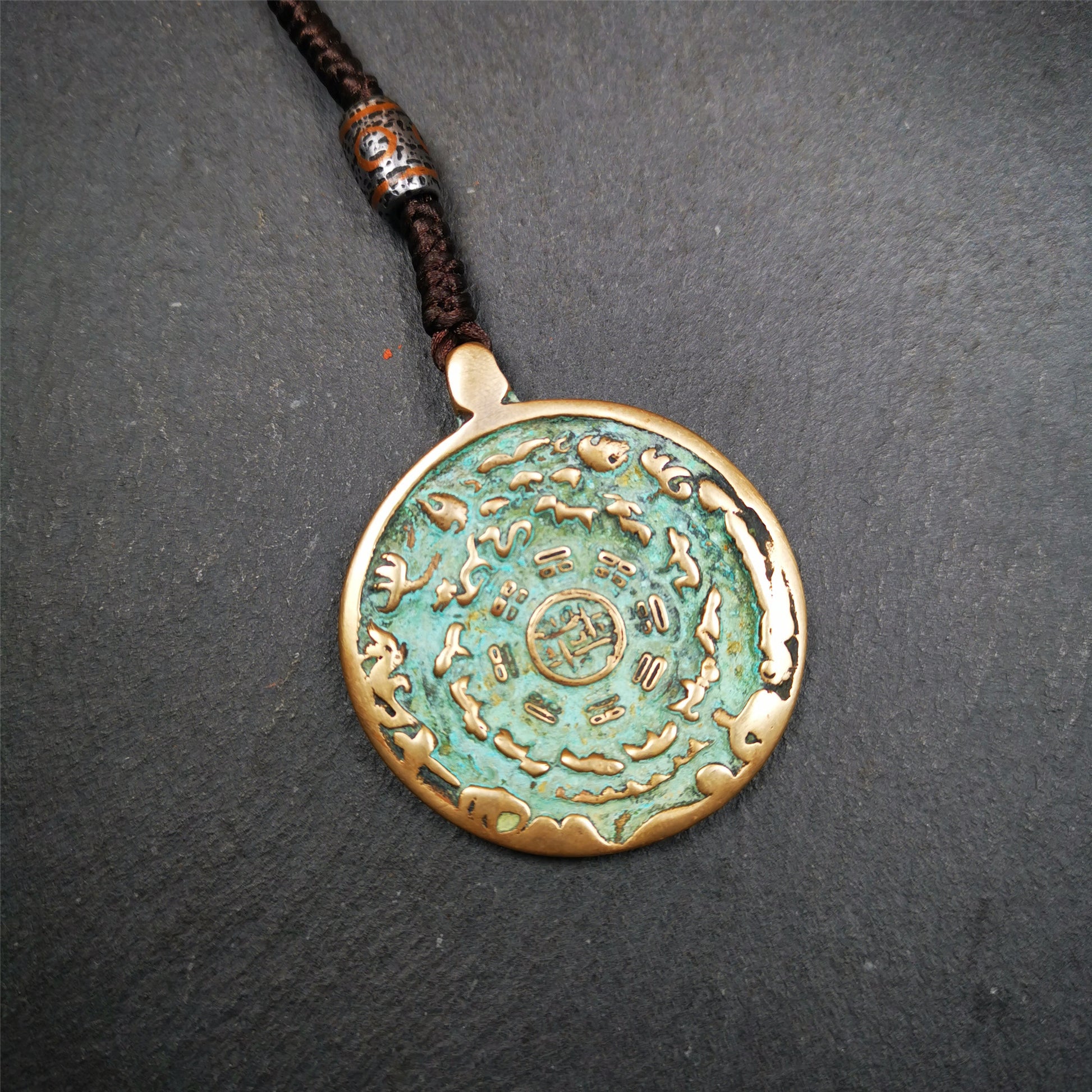 This unique tibetan melong badge was collected from Kathok Monastery,about 50 years old. It's a Astrology Protective Amulet Pendant,made of lima brass. The pattern is Tibetan Budhist Protective Amulet Pendant - SIPAHO(srid pa ho).