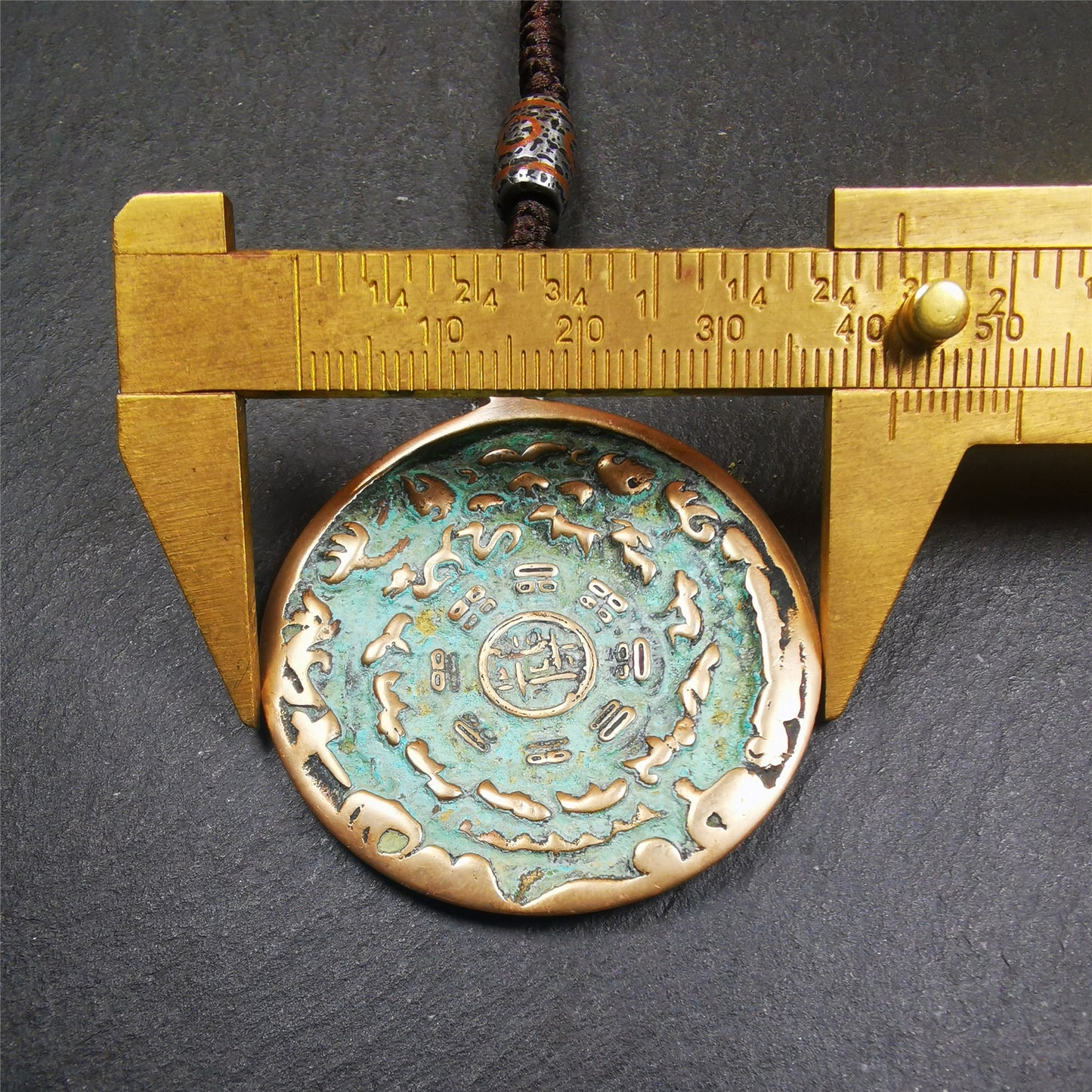 This unique tibetan melong badge was collected from Kathok Monastery,about 50 years old. It's a Astrology Protective Amulet Pendant,made of lima brass. The pattern is Tibetan Budhist Protective Amulet Pendant - SIPAHO(srid pa ho).