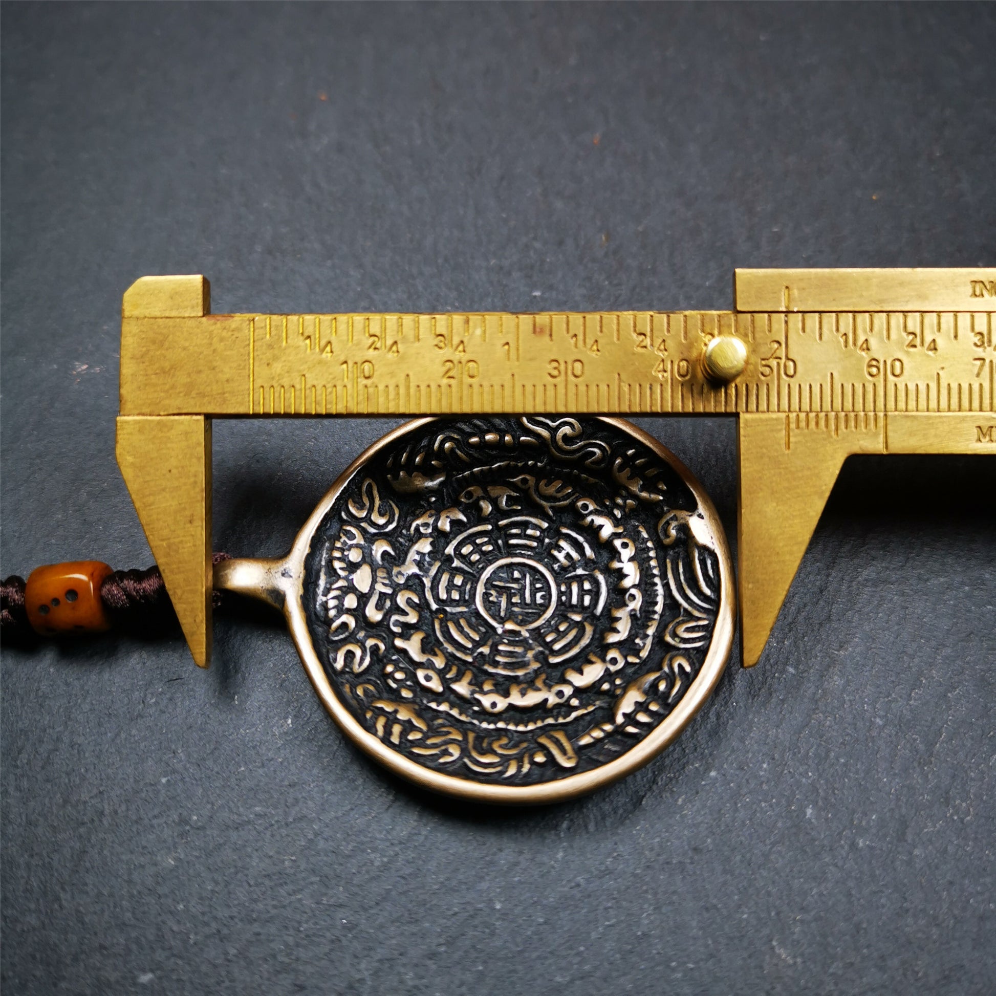 This unique tibetan calendar melong badge was collected from Baiyu Monastery for 30 years. It's a Astrology Protective Amulet Pendant,made of copper. The pattern is Tibetan Budhist Protective Amulet Pendant - SIPAHO(srid pa ho).