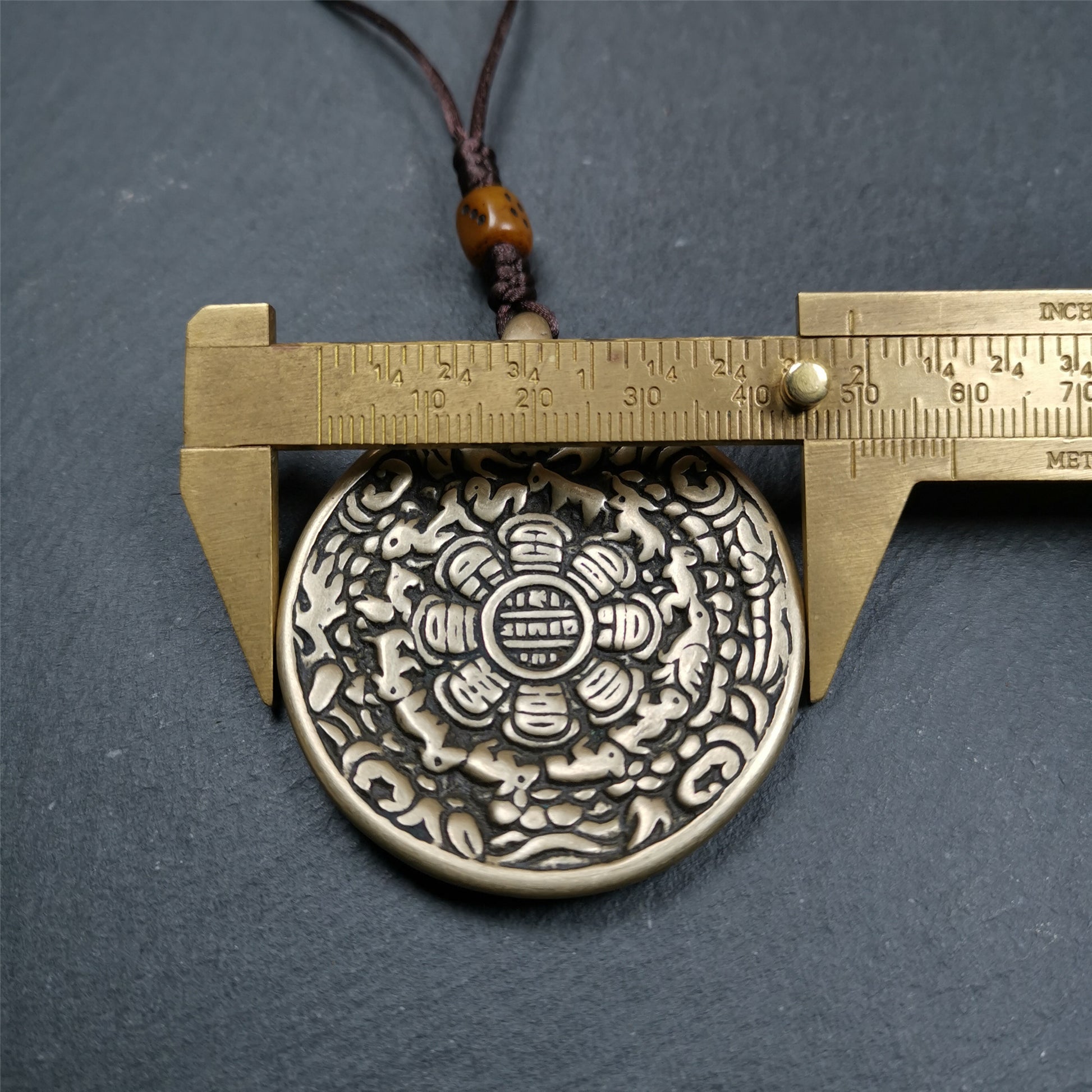 This unique tibetan melong badge was collected from Baiyu Monastery for 30 years. It's a Astrology Protective Amulet Pendant,made of cold iron. The pattern is Tibetan Budhist Protective Amulet Pendant - SIPAHO(srid pa ho).