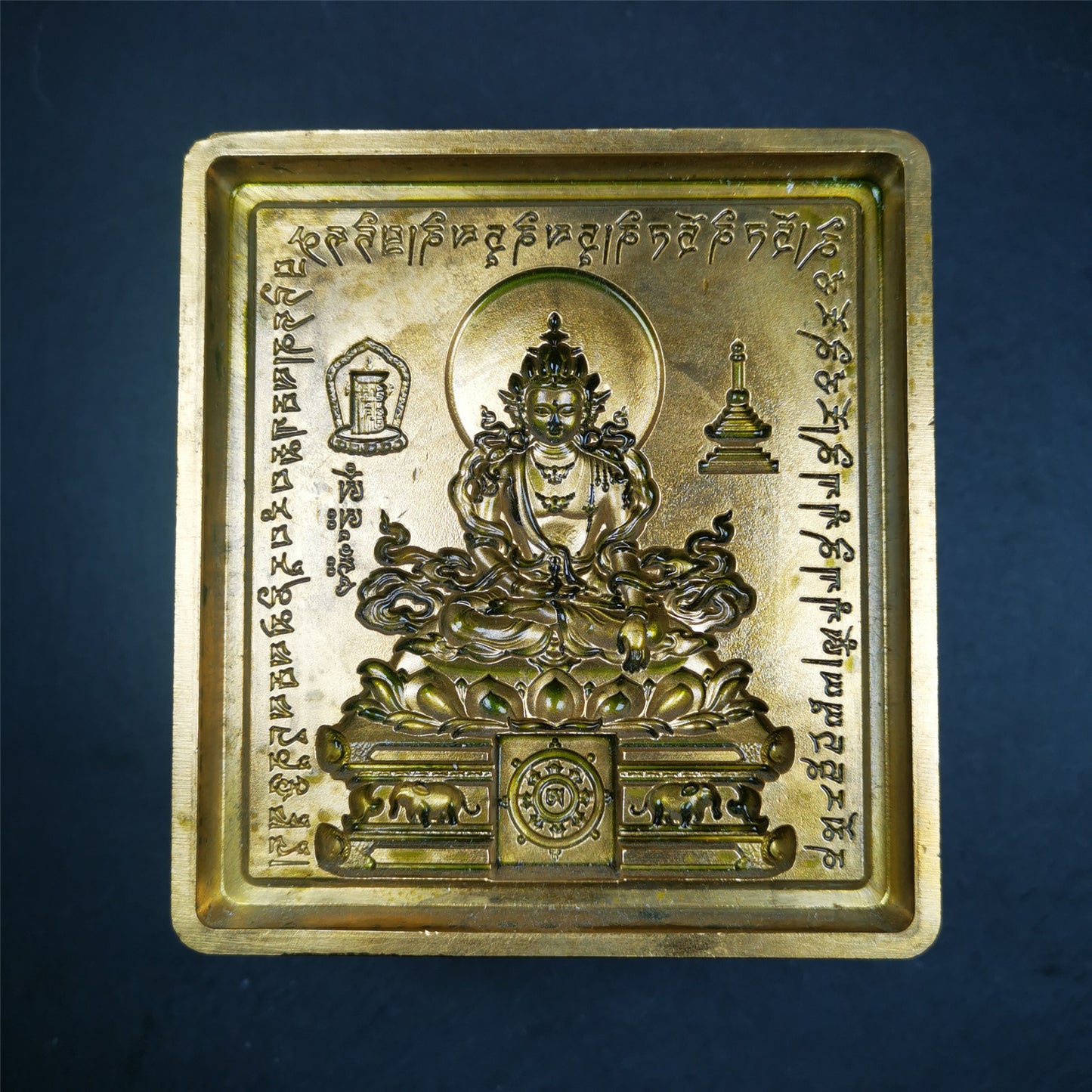 This unique Akshobhya Tsa-Tsa buddha statue mold is made by Tibetan craftsmen in Hepo Township, Baiyu County. With this exquisite mold, you can use clay to make your own Buddha statue as a decoration or consecration. The statue that you make from your moulds can be left plain or painted.