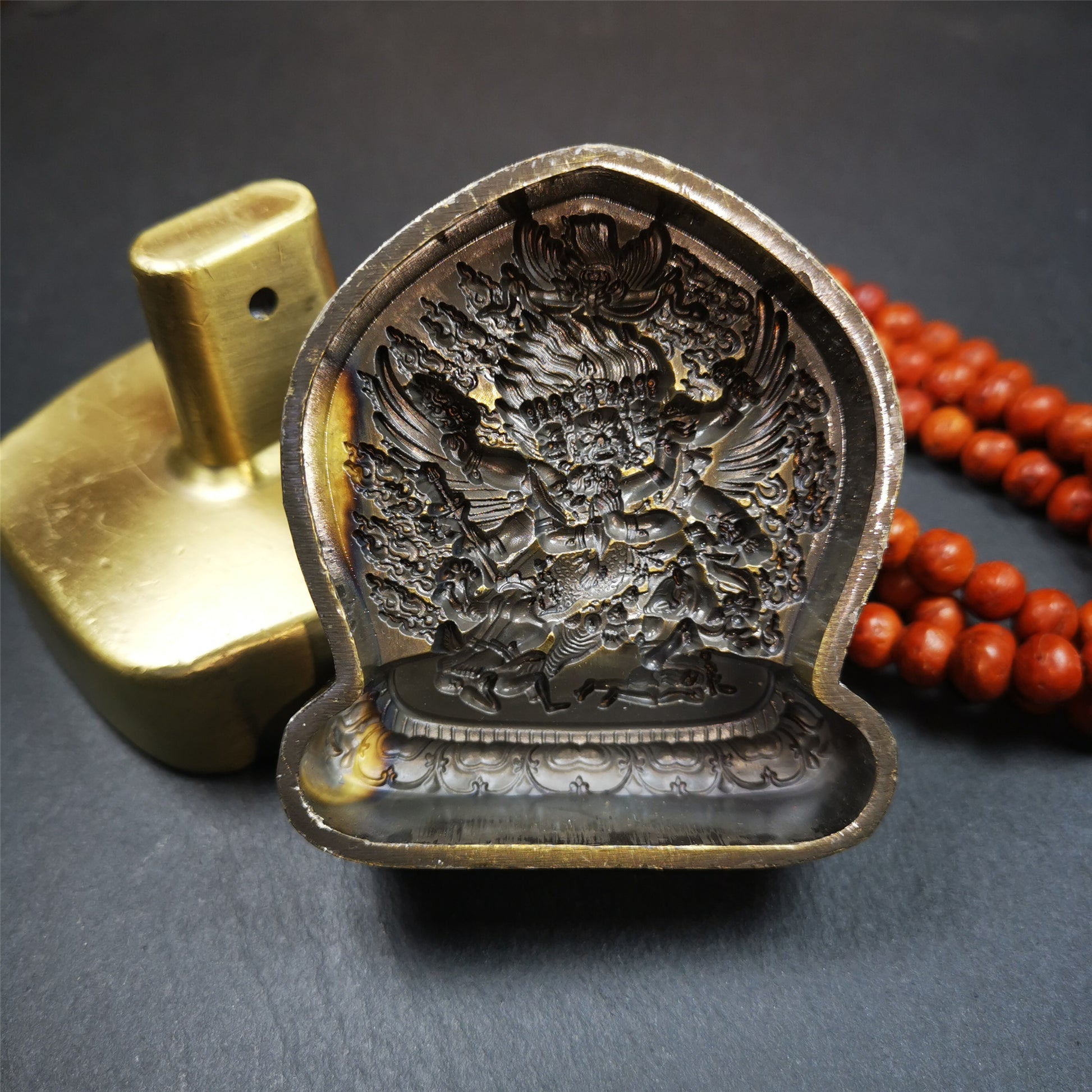 This Vajrakilaya Tsa-Tsa is made by Tibetan craftsmen in Hepo Town, Baiyu County. It is made of brass,yellow color,the shaple is Vajrakilaya,about 2.8inches height. With this mold, you can use clay to make your own Buddha statue.