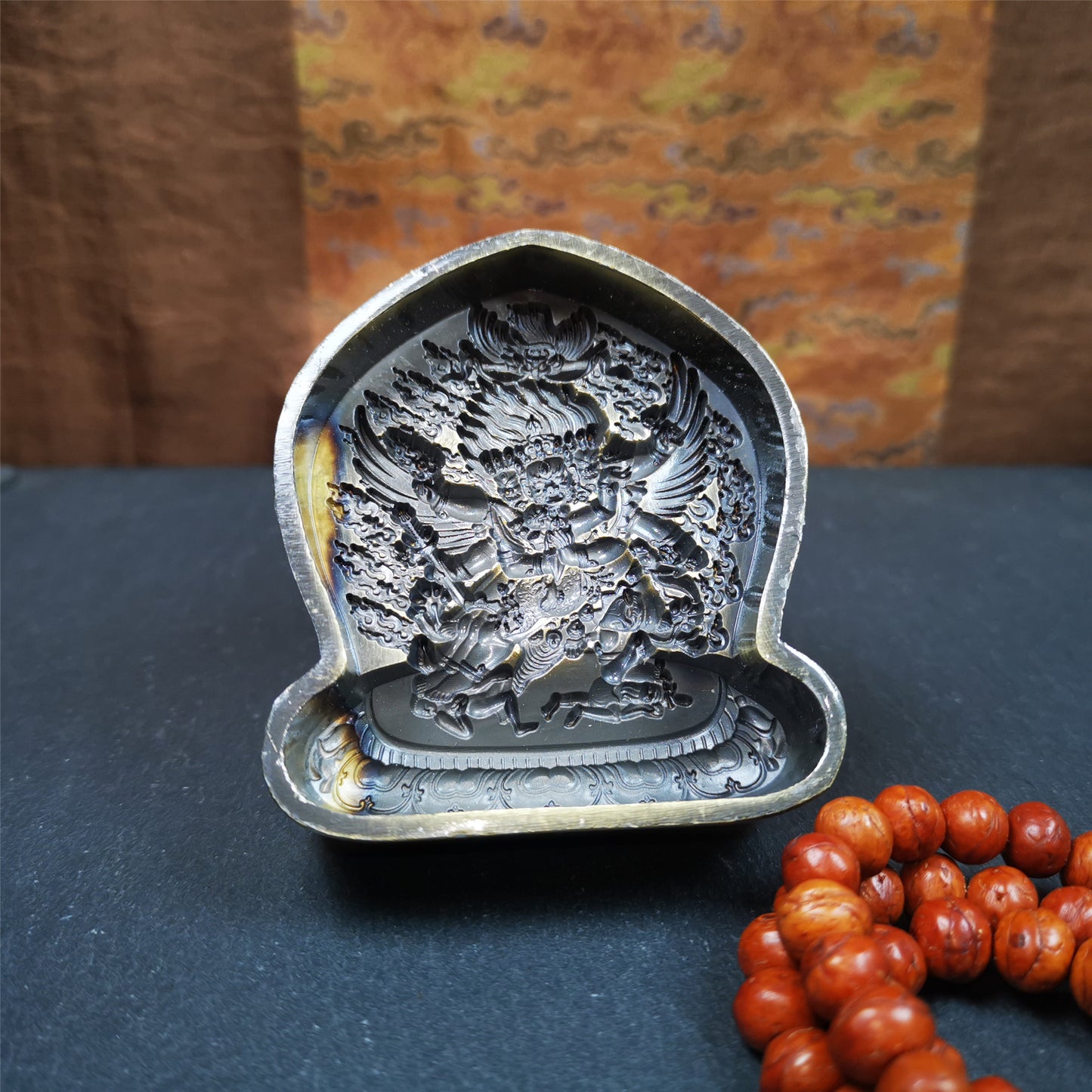This Vajrakilaya Tsa-Tsa is made by Tibetan craftsmen in Hepo Town, Baiyu County. It is made of brass,yellow color,the shaple is Vajrakilaya,about 2.8inches height. With this mold, you can use clay to make your own Buddha statue.