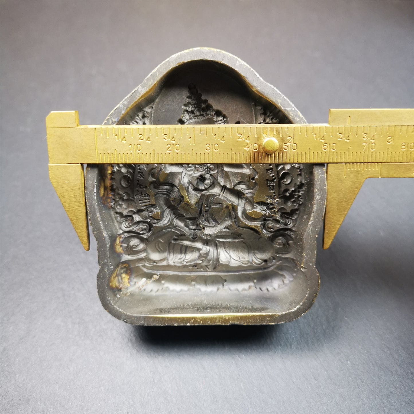 This Vajrapani Tsa-Tsa is made by Tibetan craftsmen in Hepo Town, Baiyu County. It is made of brass,yellow color,the shaple is Vajrapani,about 2.8inches height. With this mold, you can use clay to make your own Buddha statue.