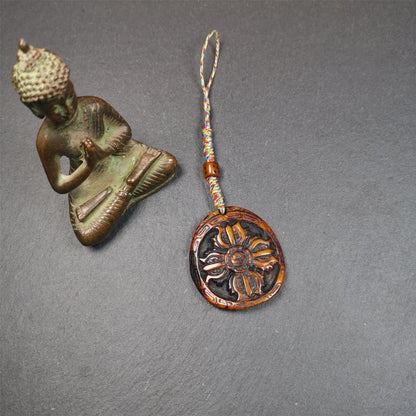 This cross vajra badge amulet was hand carved by Tibetan craftsmen and come from Hepo Town, Baiyu County, the birthplace of the famous Tibetan handicrafts. It is made of yak bone, completely hand-carved, very delicate.