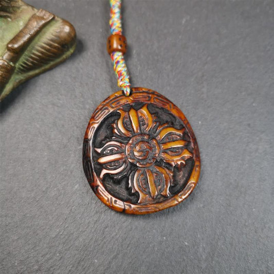 This cross vajra badge amulet was hand carved by Tibetan craftsmen and come from Hepo Town, Baiyu County, the birthplace of the famous Tibetan handicrafts. It is made of yak bone, completely hand-carved, very delicate.