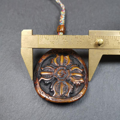 This cross vajra badge amulet was hand carved by Tibetan craftsmen and come from Hepo Town, Baiyu County, the birthplace of the famous Tibetan handicrafts. It is made of yak bone, completely hand-carved, very delicate.