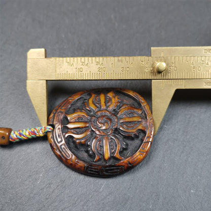 This cross vajra badge amulet was hand carved by Tibetan craftsmen and come from Hepo Town, Baiyu County, the birthplace of the famous Tibetan handicrafts. It is made of yak bone, completely hand-carved, very delicate.