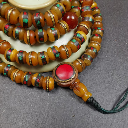 This mala bracelet was made by Tibetan craftsmen. It is made of yak bone,copper wire inlaid colorful color,108 beads diameter of 8mm / 0.32",circumference is 72cm / 28",with old agate beads.