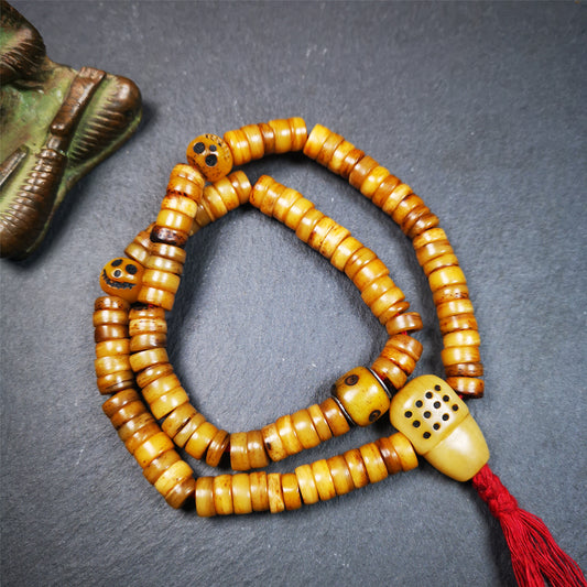 This yak bone mala was handmade from tibetan crafts man in Baiyu County,about 30 years old. It's composed of 108 pcs 9mm bone beads,with bone carved beads,guru bead.