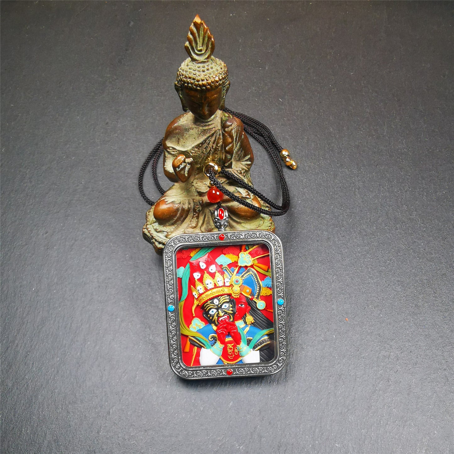 This Drashi Lhamo Gau box is made by Tibetan craftsmen in Hepo Township, Baiyu County,filled in a unique fashion Drashi Lhamo Tsa Tsa - Tibetan girl wearing her mask,made of pottery clay,hand painted.